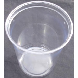 Transparent plastic cup on a dark surface, empty, with light reflections.