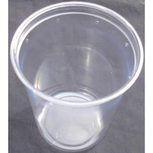 Transparent plastic cup on a dark surface, empty, with light reflections.
