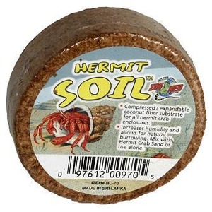 Round compacted substrate brick labeled "Hermit Soil" with a red crab illustration on the label.