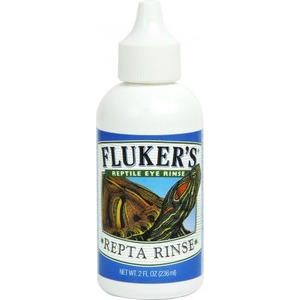 Fliker's Reptile Eye Rinse bottle with blue label and an illustrated lizard.