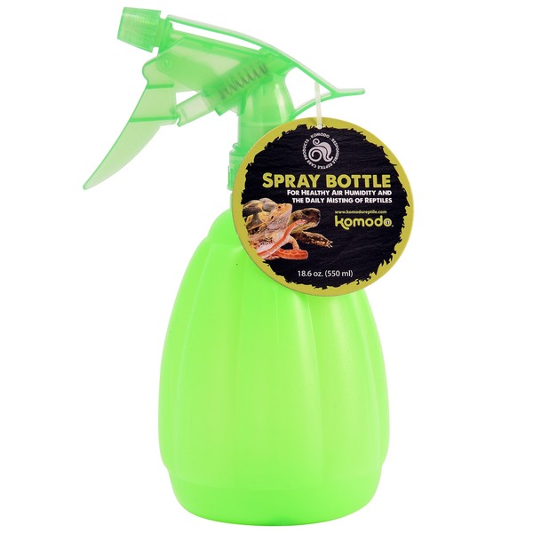 Bright green spray bottle with a circular black-and-gold label attached.