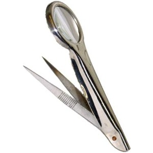 Stainless steel manicure scissors with a built-in magnifying loupe.