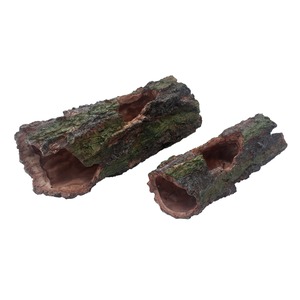 Two hollow, mossy logs with weathered brown exterior and pinkish interior cavities.