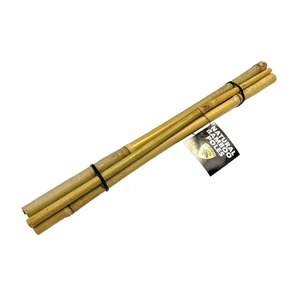 Bamboo poles bound with black ties, with a tag that reads Natural Bamboo Poles.