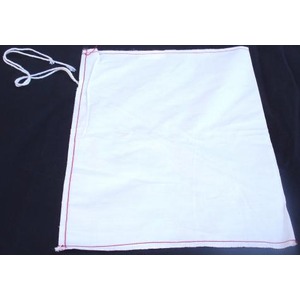 White cloth with red stitched border along edges and tied cords on the left.