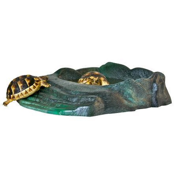 Greenish rock sculpture with a turtle on the rim and two turtles peeking from a hollow.