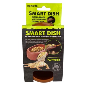 Komodo Smart Dish packaging in neon green and black, featuring a bearded dragon and a bowl of pellets.