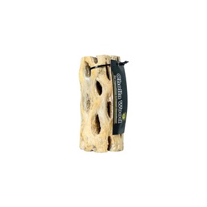 Beige hollow driftwood dog chew toy with multiple holes and a black label reading Cholla Wood