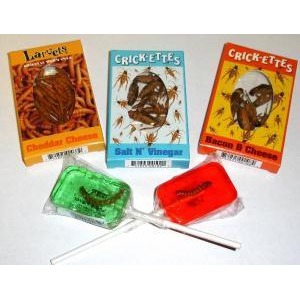 Three Crickette snack packets—Cheddar Cheese, Salt ’n’ Vinegar, Bacon & Cheese—with two green and red lollipop candies.