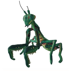 Green mantis-like toy with large serrated jaws and spiky legs, posed upright.