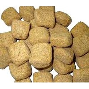Pile of light brown square kibble pieces.