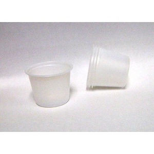 Two white plastic cups on a white surface, one upright and the other tipped over.