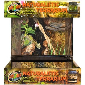 Glass terrarium with naturalistic enclosure, plants, wood, and a small lizard habitat setup.