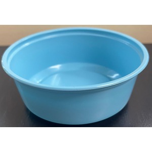 Light blue plastic bowl with a small amount of water inside, sitting on a dark surface.